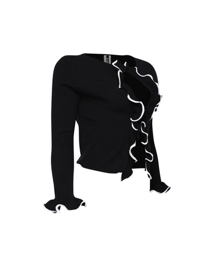 Long sleeve black top with white ruffle details and cropped shape

