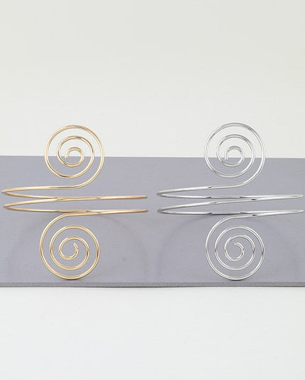 Polished silver cuff bracelet with geometric spiral wire design

