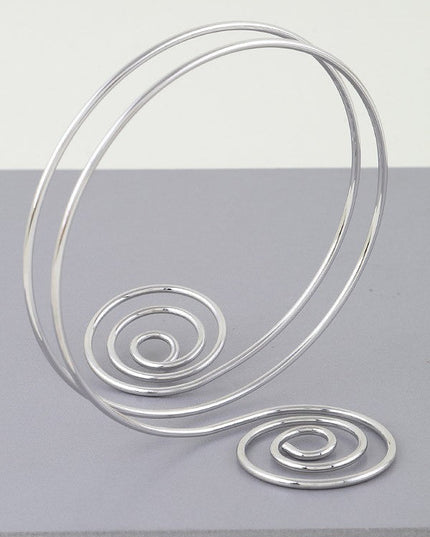 Silver spiral arm cuff with twin swirl shape and open wire wrap

