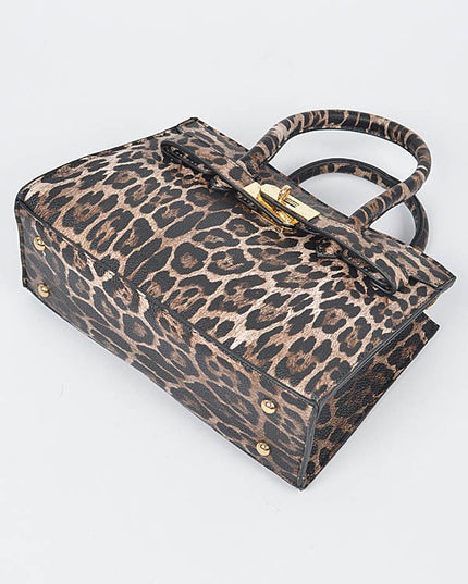 Bottom view of leopard print handbag showing reinforced corners and gold studs.