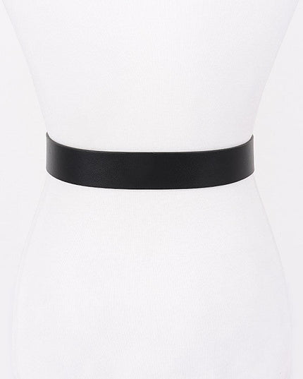 Floral scroll engraved buckle on faux leather waist belt

