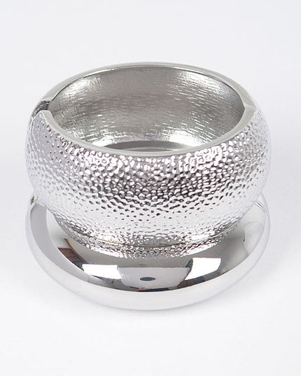 Silver hammered bangle with rounded dome shape and metallic finish

