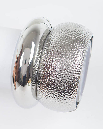 Silver polished bangle bracelet with glossy mirrored metal surface

