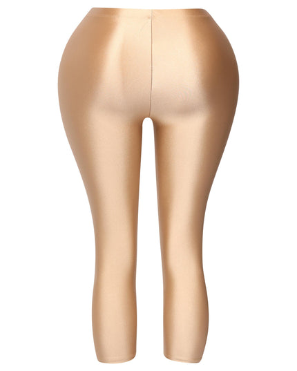 Gold leggings with smooth, shiny fabric and curve-enhancing design

