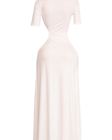 Clean white short sleeve dress with asymmetrical cutouts and fluid hemline

