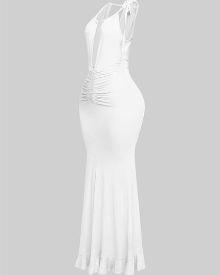 White beachy halter dress with deep neckline and flirty movement

