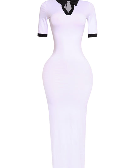 Sporty white and black contrast dress with tight stretch fabric, shown from the left side

