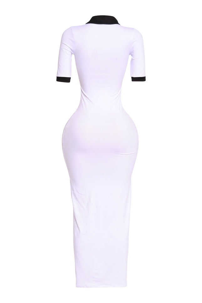 Back angle of white polo-inspired maxi with black collar and cuffs, minimalist athletic vibe

