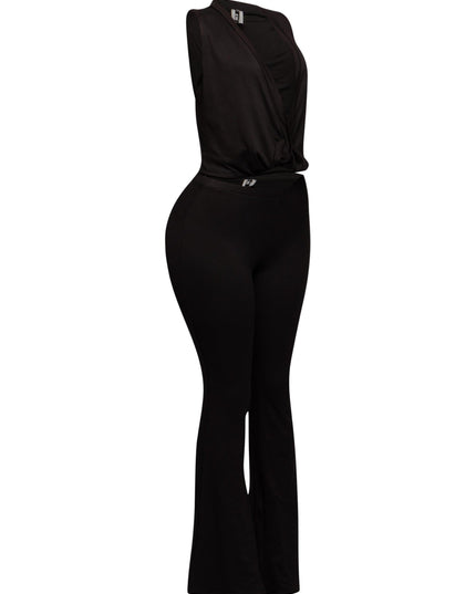 Sleeveless black twist front crop top with curve-hugging pants in stretchy knit