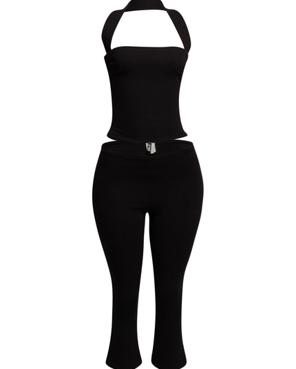 Sleek black halter top and fitted capri pant set, perfect for edgy, on-trend party looks.