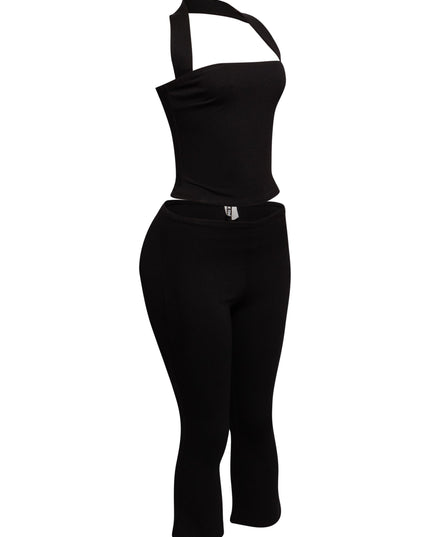Chic halter neck top paired with figure-hugging capri pants, ideal for a bold and sophisticated outfit.