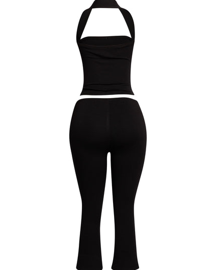 Minimalist yet striking black two-piece set featuring a halter top and cropped capri pants, perfect for nights out.