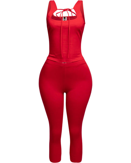 Vibrant red tank top with a chic tie-front detail, paired with fitted capri pants for a bold and playful look.