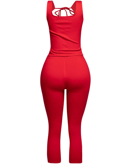Trendy red two-piece outfit featuring a tie-front tank top and flattering capri pants, ideal for day-to-night transitions.
