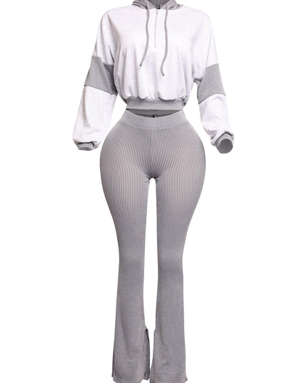 Modern gray two-piece lounge set featuring a cropped pullover hoodie and high-waisted flared pants with a ribbed design. Perfect for a sleek, minimalist look with a cozy twist.