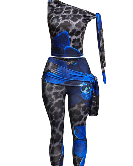 Side view of blue animal print 2-piece outfit with stretch crop top and capri leggings

