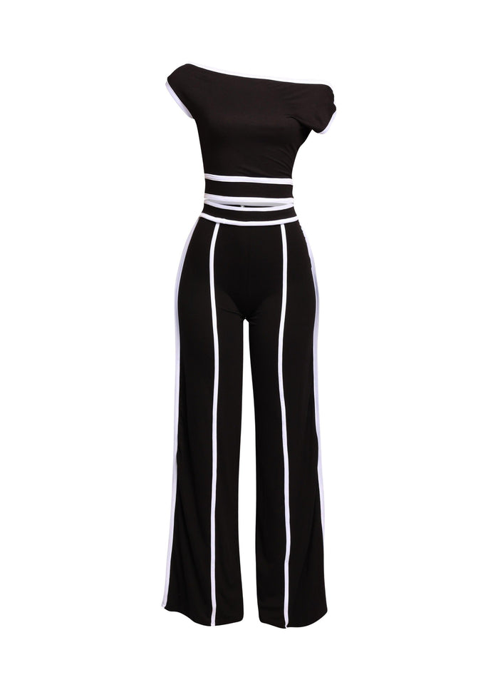 Bold color-contrast off-shoulder pant set with striking white trim, perfect for edgy and statement-worthy looks.