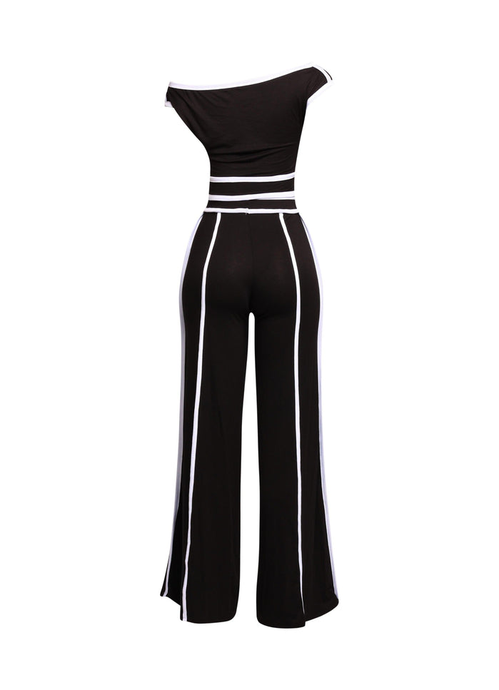 Chic and modern black-and-white off-shoulder pant set, featuring wide-leg pants for a sleek, high-fashion vibe.