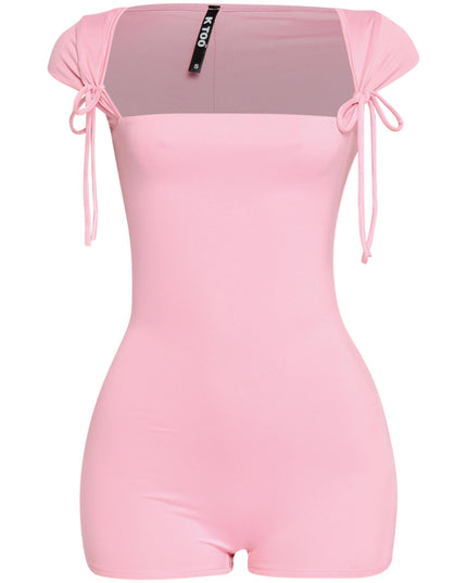 Baby pink cap sleeve romper with front-tie shoulder accents and soft girlcore energy

