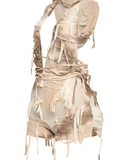 Pale tie-detail romper in sheer grunge mesh with edgy backless design

