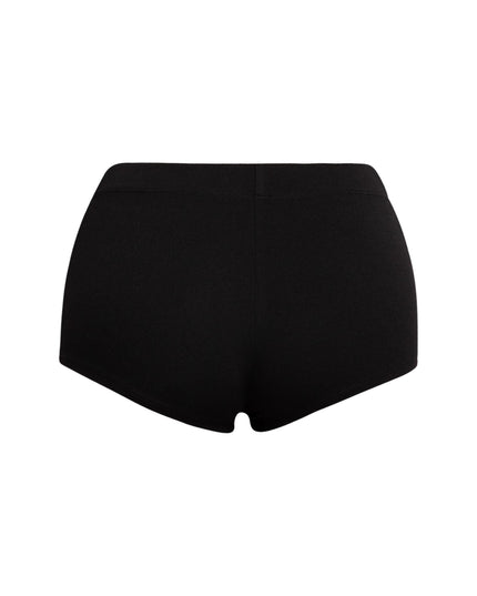 Chic black micro shorts featuring pintuck accents and a stretchy waistband, perfect for versatile casual looks or edgy streetwear styling.