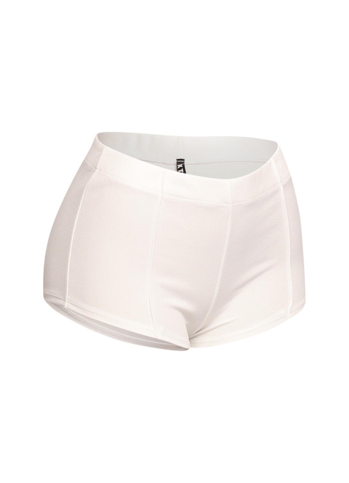 Minimalist white micro shorts with a pintuck finish and comfortable elastic waistband, perfect for modern streetwear or layered statement looks.