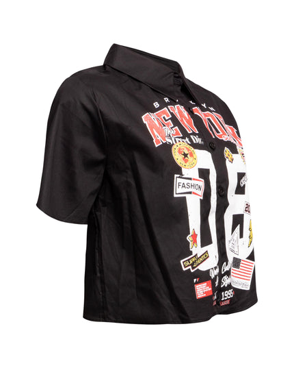 Right side view of black New York-themed graphic shirt with partial view of front print