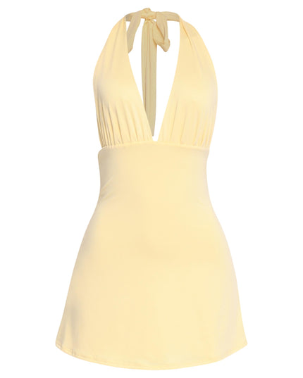 Breezy yellow halter dress with low back and feminine silhouette

