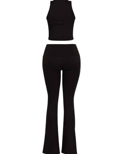 Black matching set featuring Y2K-inspired twist front top and sleek high-waisted pants

