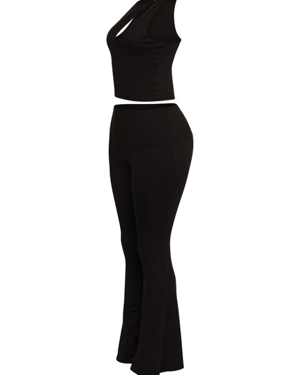Streetwear-ready black flare pant set with shoulder cut-out crop top for a bold night-out look

