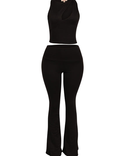 Trendy black co-ord outfit with cut-out top and high-rise pants designed to elongate legs

