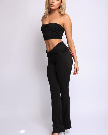Black twist bandeau top and flared pants two-piece set with sleek finish

