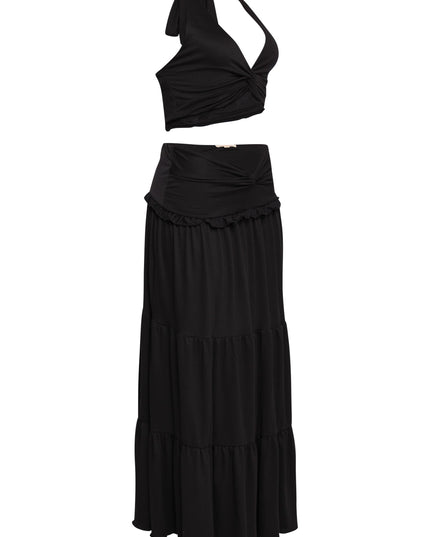 Black twist halter crop and V-waist maxi skirt combo with soft volume

