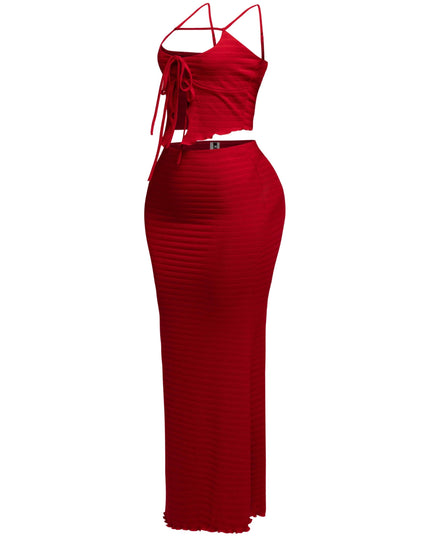 Bold red two-piece skirt set with flirty ruched top and sultry body-skimming silhouette

