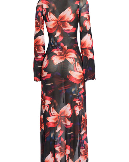 Black combo mesh top with dramatic ruffles and lightweight drape styled with heels for chic resort or poolside look